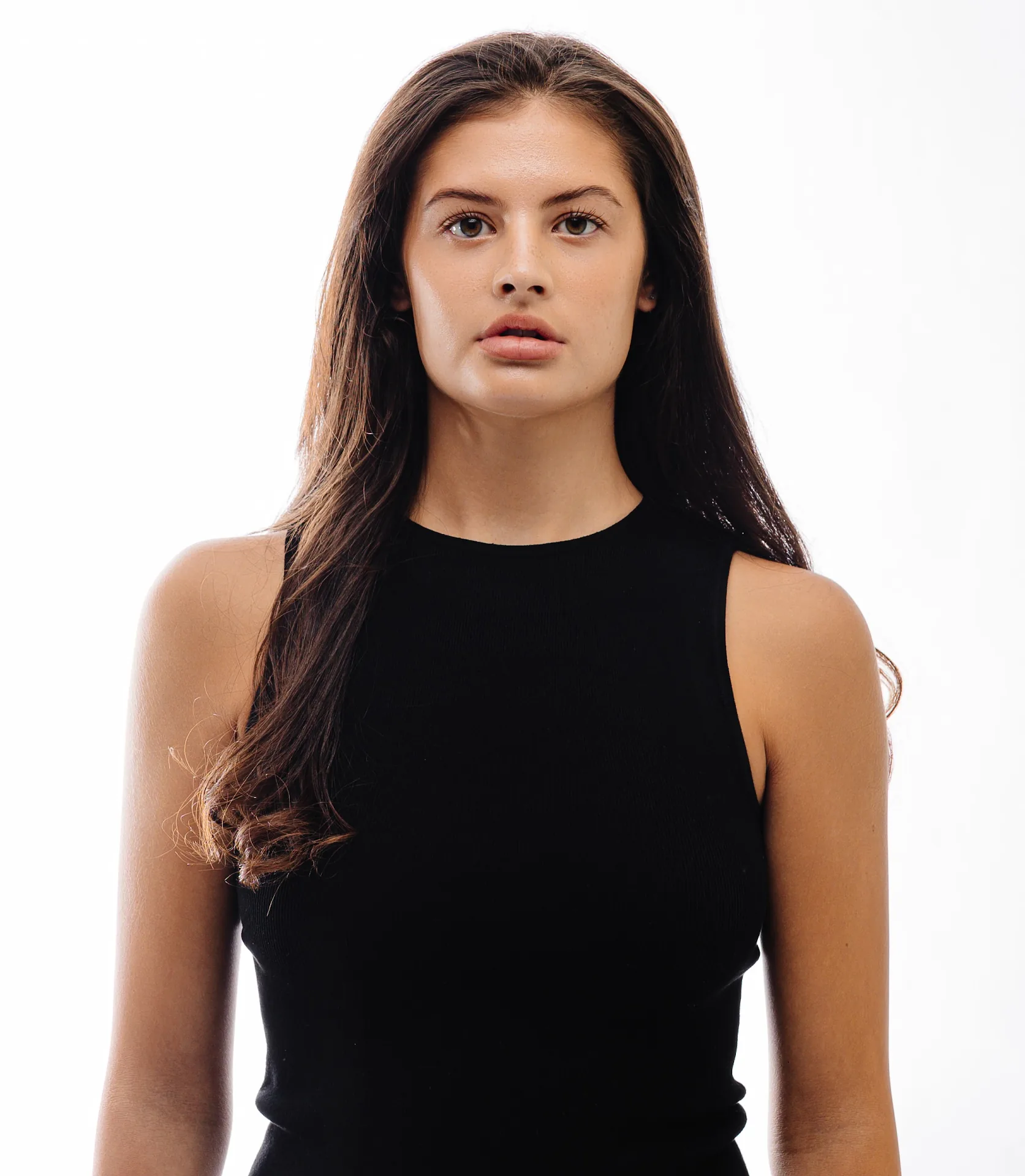 Waist-up studio portrait against white background