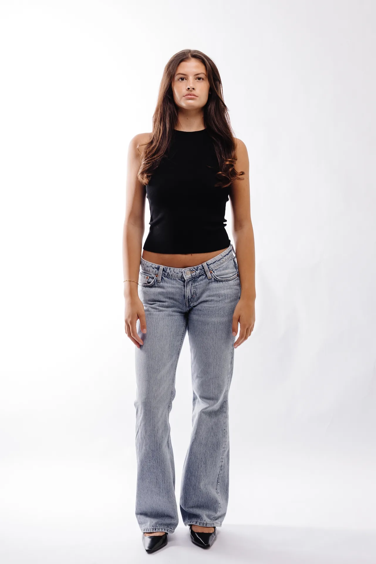 Full-length straight on studio portrait against white background